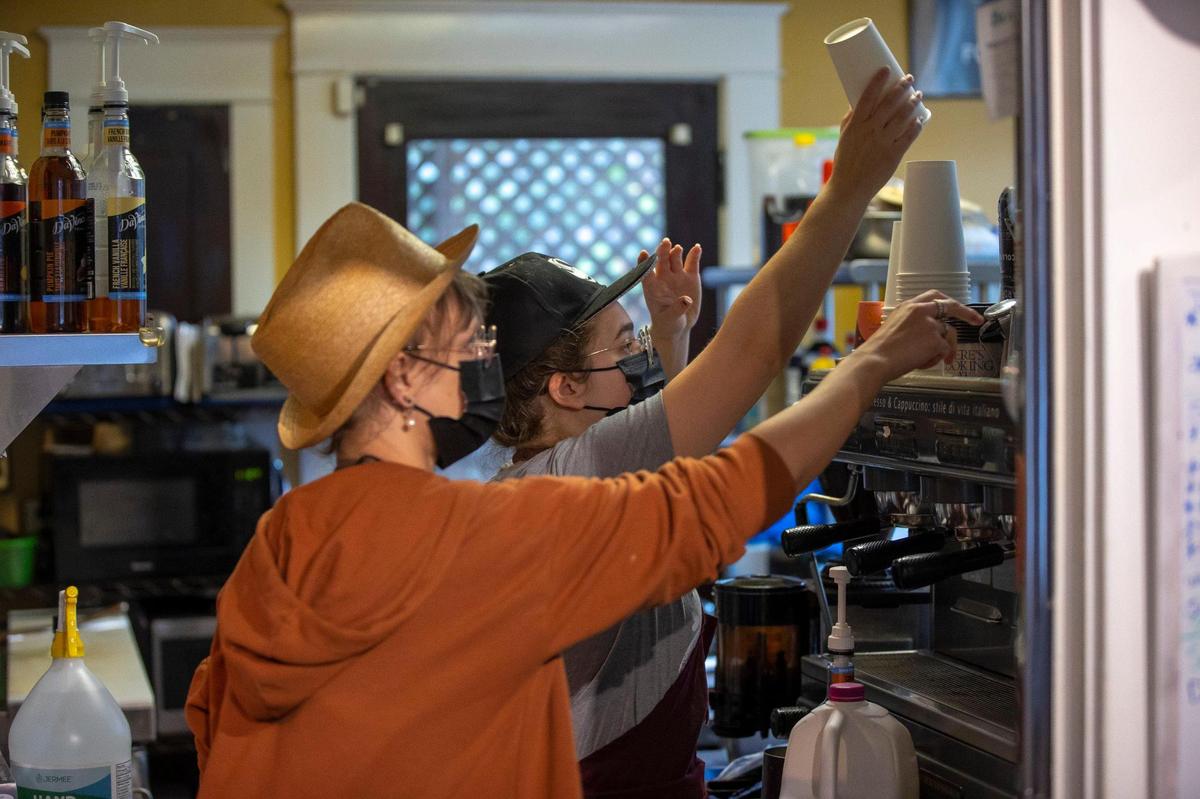Meghan Rader, left, and Ekat Brennan prepare drinks at High on Art & Coffee at 523 East High St. in Lexington, Ky., on Thursday, Oct. 21, 2021.