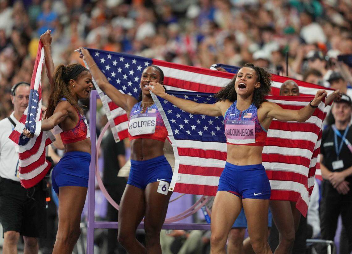Aug 10, 2024; Saint-Denis, FRANCE; Shamier Little (USA), Sydney McLaughlin-Levrone (USA), Gabrielle Thomas (USA) and Alexis Holmes (USA) celebrate after winning the women's 4x400m final during the Paris 2024 Olympic Summer Games at Stade de France. Mandatory Credit: James Lang-USA TODAY Sports