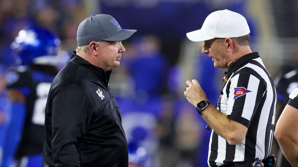 Kentucky head coach Mark Stoops talks to an official during the team’s game against Vanderbilt on Oct. 12 at Kroger Field.
