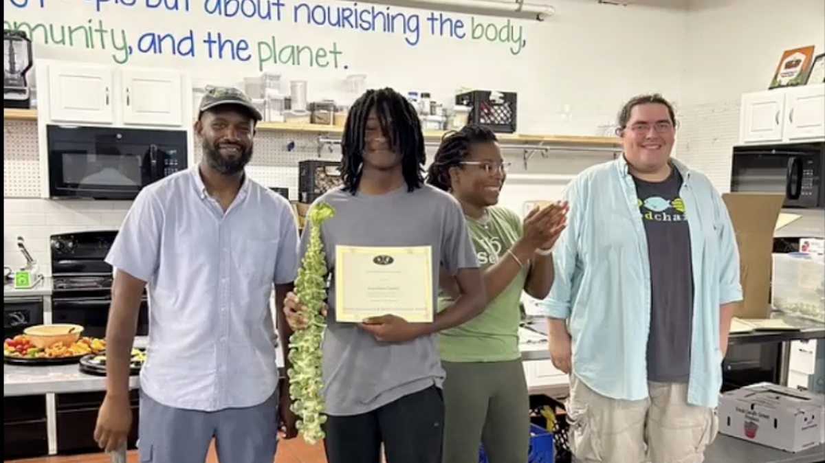 Jonathan Conley, center, was recognized recently at the national level for his short film about food insecurity.