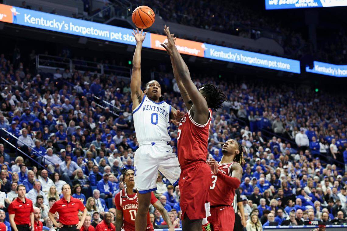 Kentucky’s Rob Dillingham (0) shoots over Arkansas’ Makhi Mitchell (15) during Saturday’s game at Rupp Arena. Dillingham contributed 15 points, two rebounds and five assists off the bench.