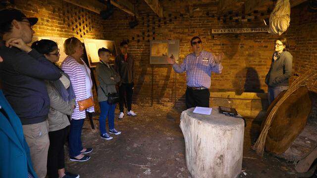 Curator and Site Manager Eric Brooks, center-right, leads a tour through the Henry Clay Estate highlighting the history of Henry Clay’s slaves that lived on property. March 12, 2020.