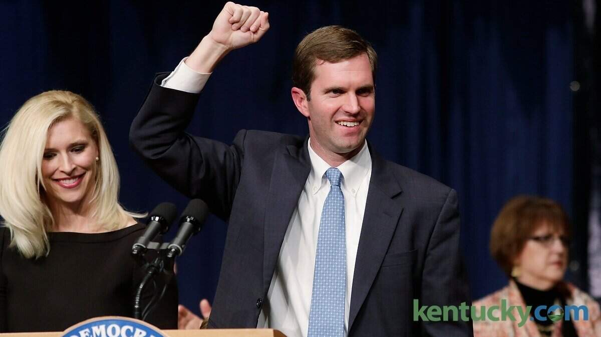 Andy Beshear with wife Britainy Beshear, left, spoke to supporters after being elected as Attorney General  at Democratic election night headquarters at the Frankfort Convention Center in Frankfort, Ky., on Nov. 3, 2015. Photo by Pablo Alcala | Staff