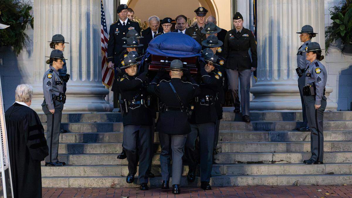 Kentucky State Police serve as pallbearers during the funeral procession, following the memorial service for former Kentucky Governor Martha Layne Collins held at the Old Capitol on Nov. 9, 2025, in Frankfort, Ky.