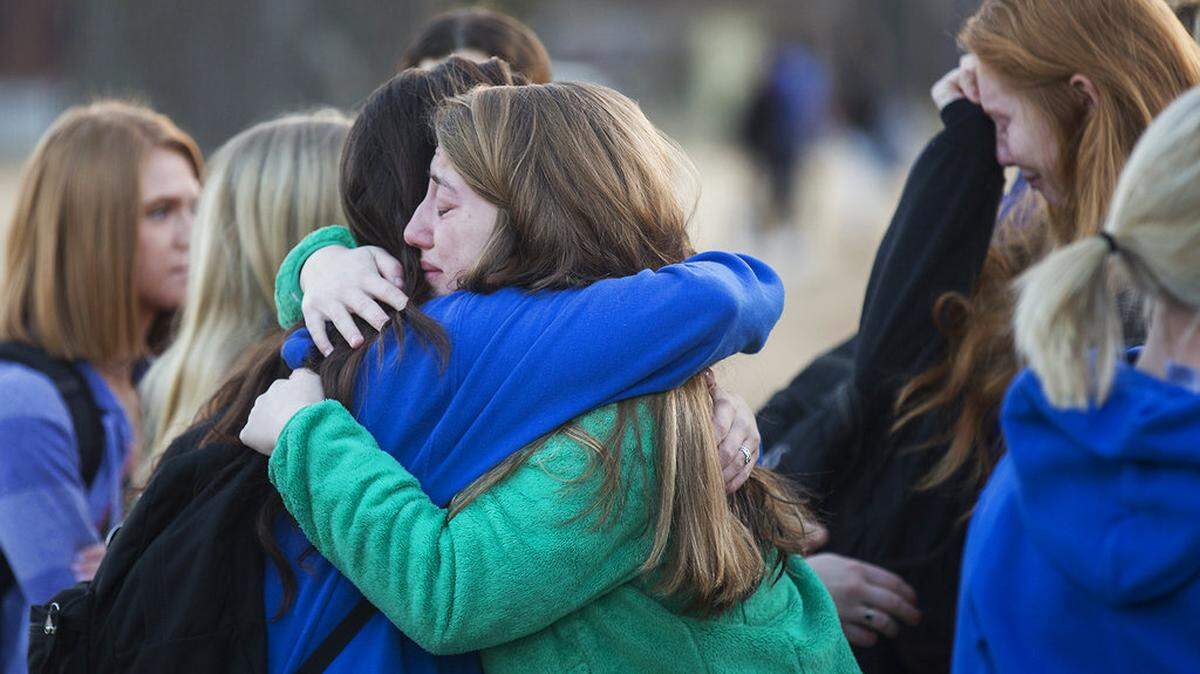 Students embraced following a prayer vigil for Marshall County High School students at Paducah Tilghman High School in Paducah Wednesday, Jan. 24, 2018.