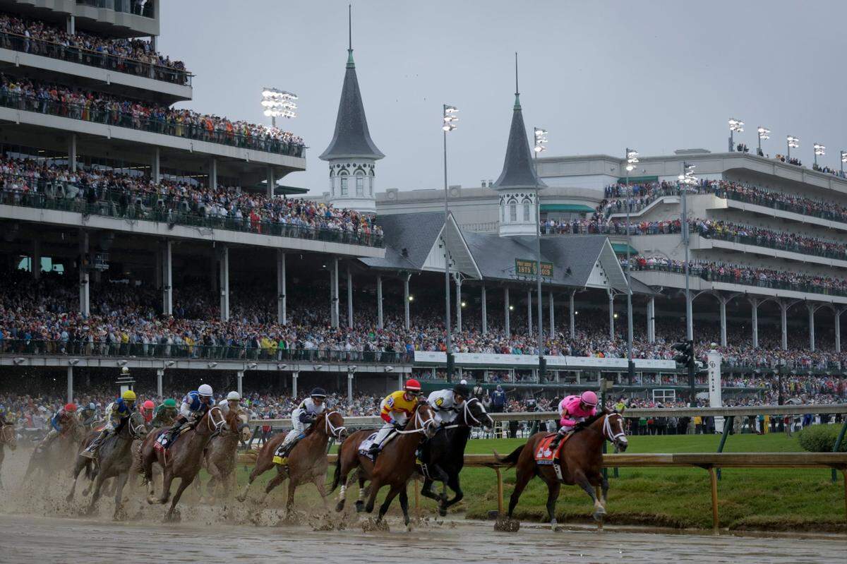 Maximum Security led the pack around the first turn in the the 145th Kentucky Derby at Churchill Downs in 2019. The 2020 event has been delayed as a result of the coronavirus.