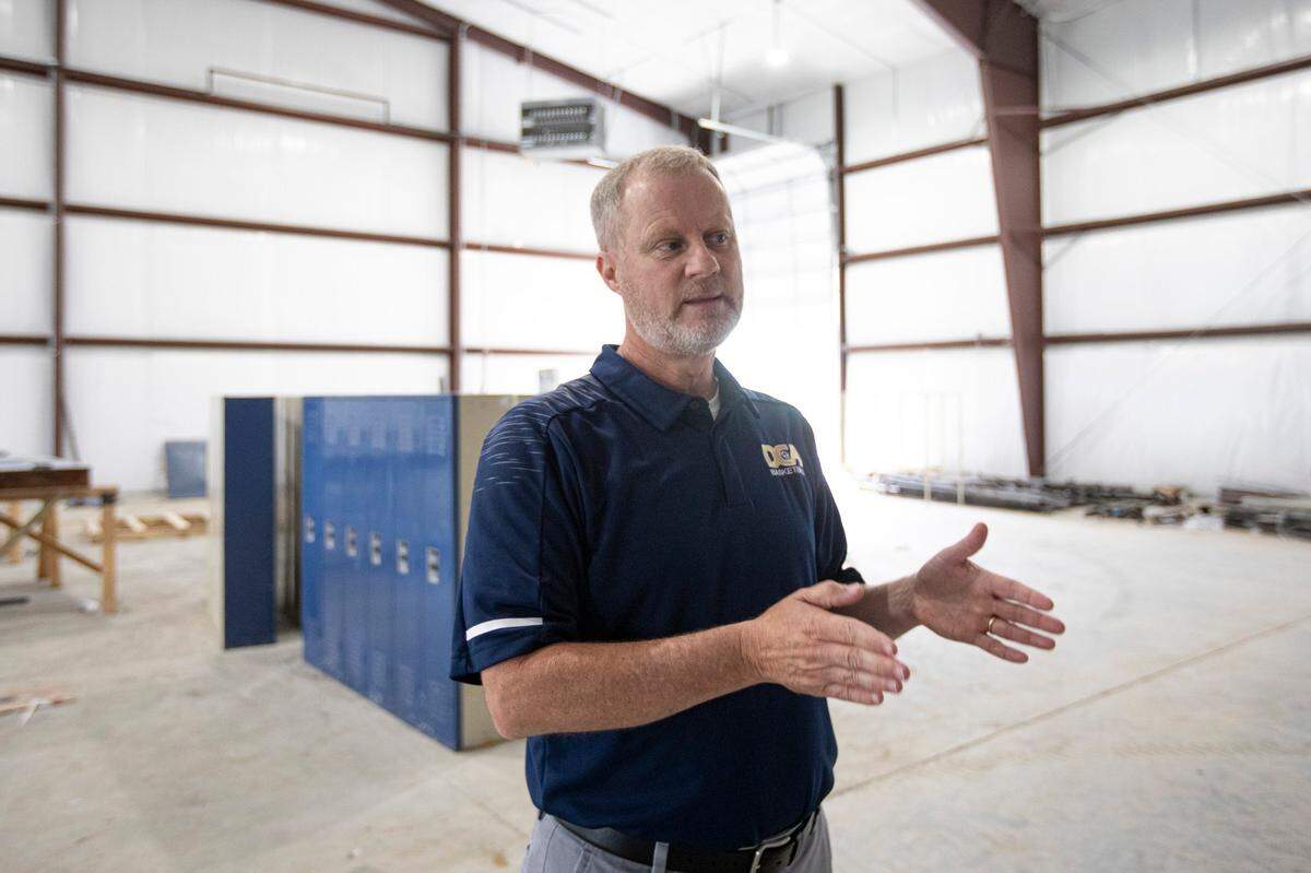 Don Story, Danville Christian Academy’s boys’ basketball coach, spoke with reporters as the school’s gym was under construction in May 2019.