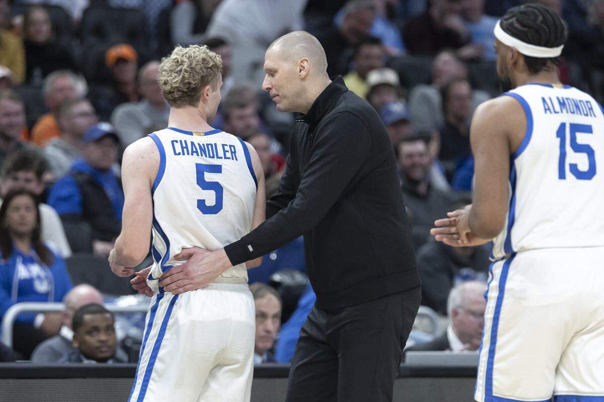 Kentucky head coach Mark Pope talks to guard Collin Chandler (5) during Friday’s first-round NCAA Tournament game at Fiserv Forum in Milwaukee.