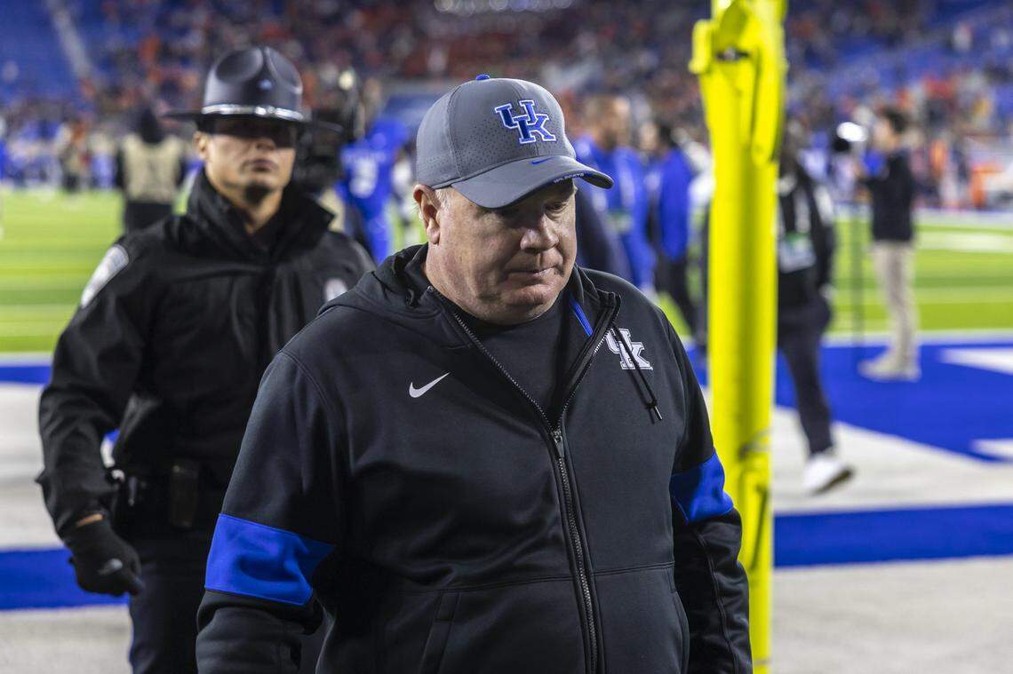 Kentucky head coach Mark Stoops walks off the field after Saturday’s loss to Auburn at Kroger Field.