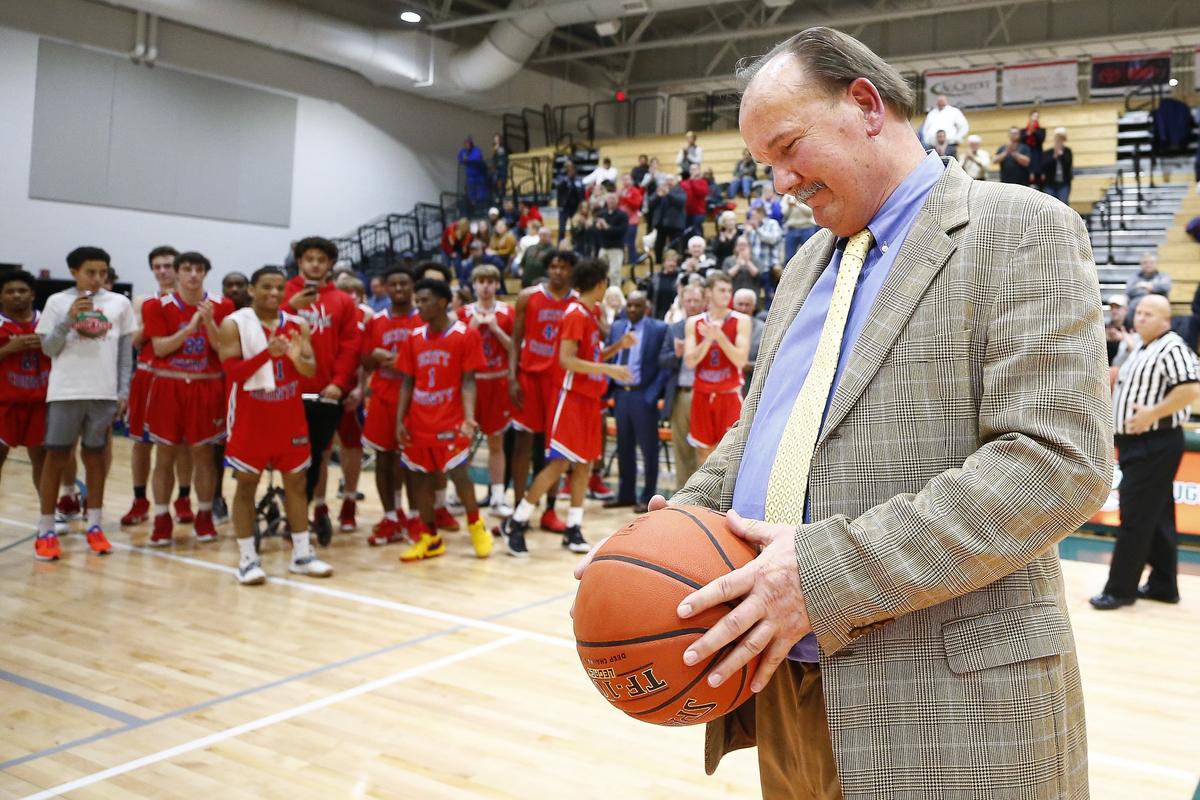 Scott County Coach Billy Hicks with the game ball from his 1,000th career victory, a 70-38 win at Frederick Douglass on Jan. 24.