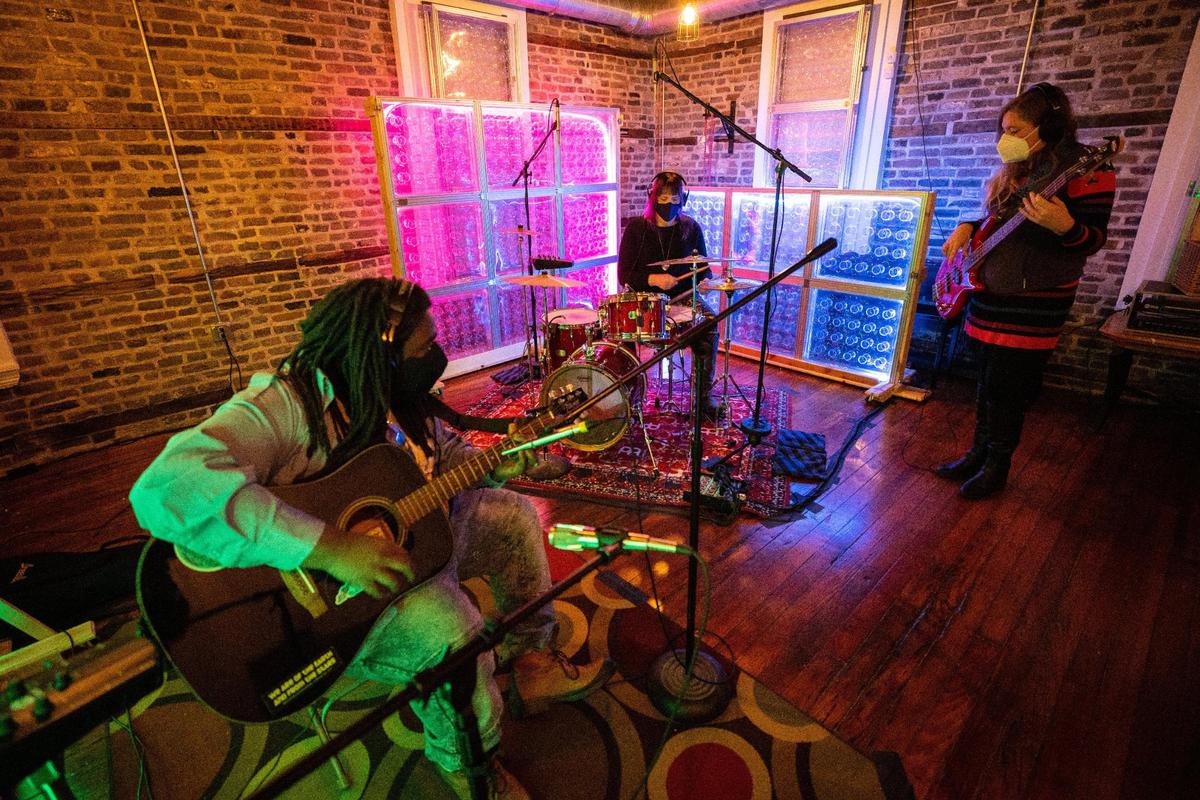 Members of Nitrosonic Studios have a jam session on Friday, Jan. 29, 2021, at Nitrosonic Studios in Lexington, Kentucky.