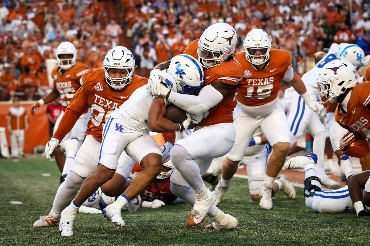 Kentucky running back Jamarion Wilcox is stopped short on fourth down in the red zone by the Texas Longhorns defense.