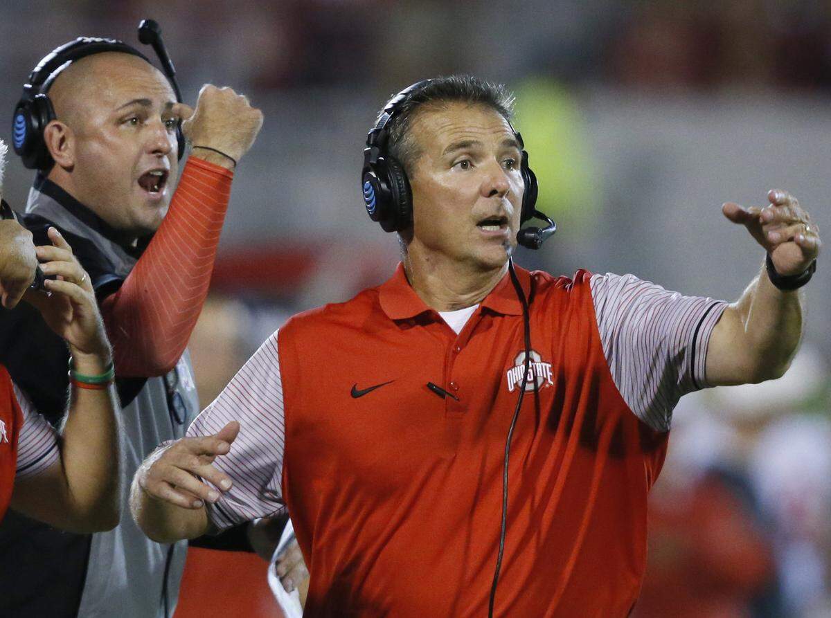 Ohio State head coach Urban Meyer, right, and then-assistant coach Zach Smith, left, gestured from the sideline during Ohio State’s 45-24 win over Oklahoma in Norman in 2016.