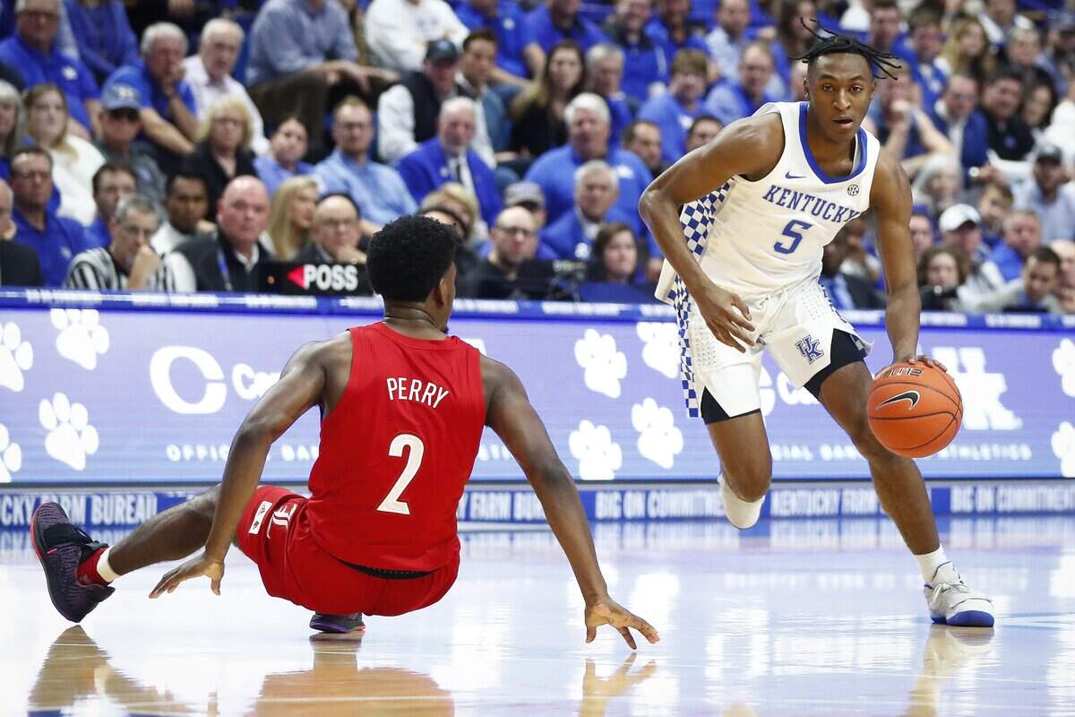 Immanuel Quickley (5) scored 18 points in a reserve role for Kentucky in Saturday’s win against Louisville.
