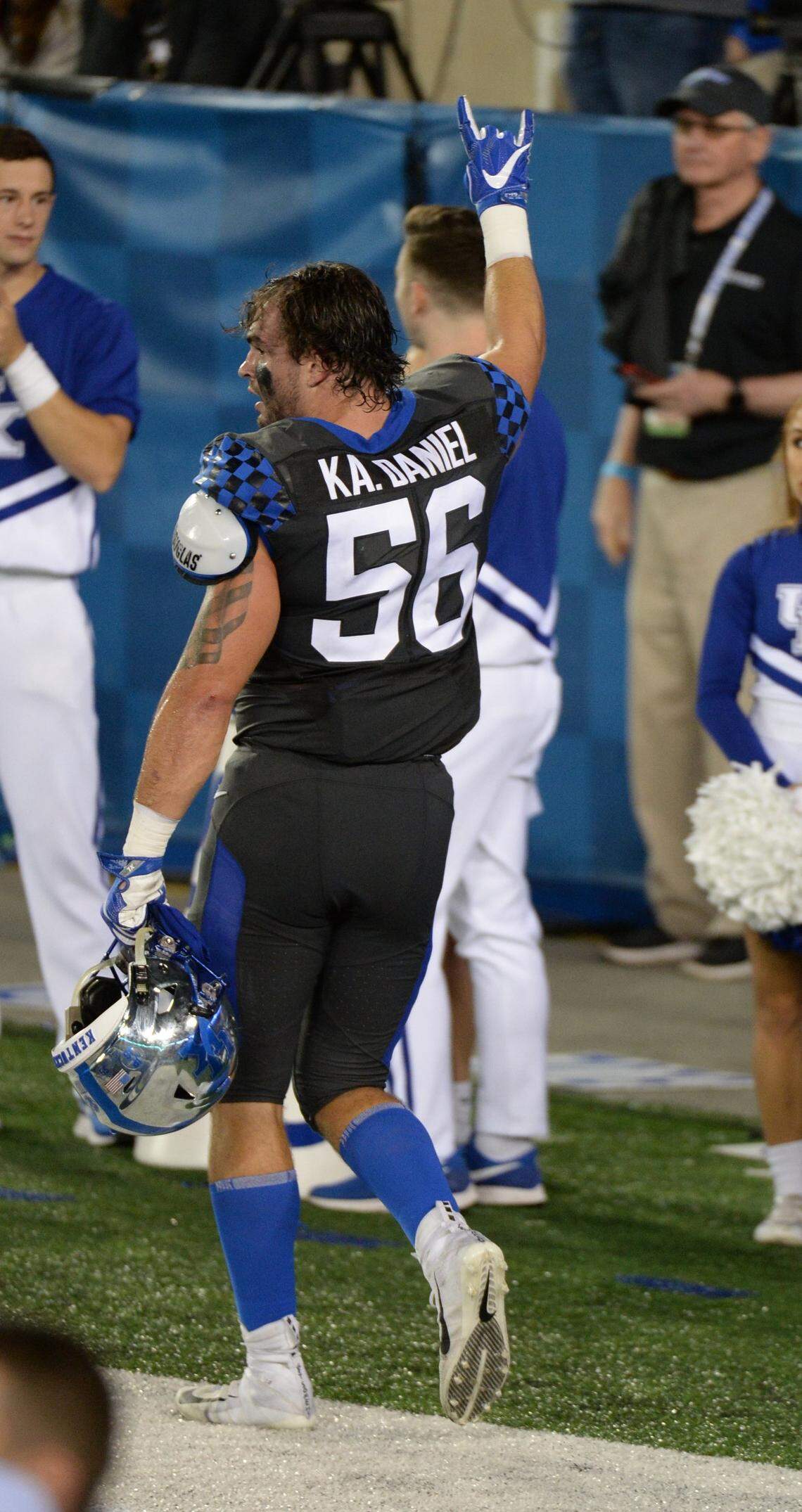 UK linebacker Kash Daniel salutes the crowd after being ejected for targeting in the third quarter of Saturday’s game.