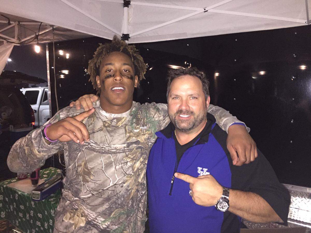 “I love that kid and his personality. … You can tell he loves the game," Scott Stephens, right, said of UK football player Benny Snell, left.