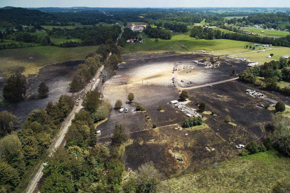 A hole in the ground is left following a gas line explosion that destroyed property and left one woman dead in Moreland, Ky., Thursday, Aug. 1, 2019.