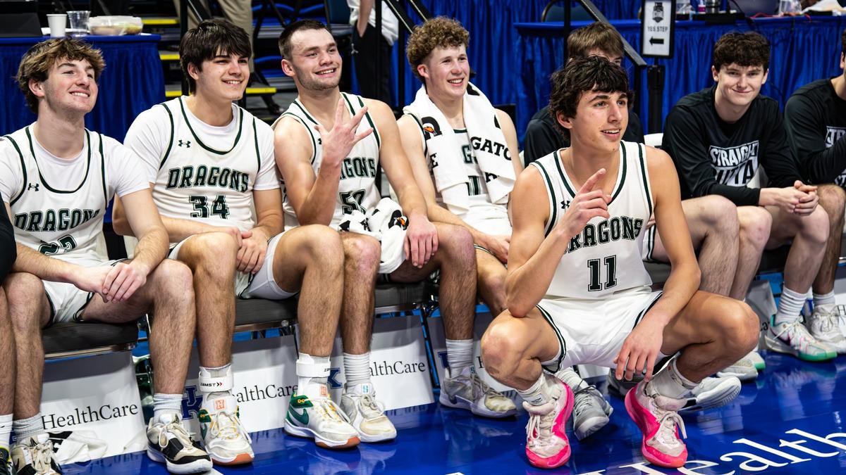 South Oldham’s Kolton Wuchterl posed with his teammates after the Dragons’ 76-75 win against Jeffersontown in the Sweet 16 quarterfinals at Rupp Arena on Friday.