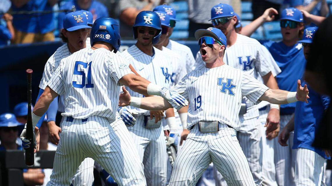 Kentucky’s Nolan McCarthy (19) and Jackson Gray (51) celebrate during the Wildcats’ 10-0 win over West Virginia at Kentucky Proud Park on Sunday. UK defeated Indiana 16-6 later Sunday to set up Monday night’s region finale vs. the Hoosiers in Lexington.