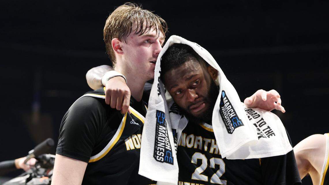 Northern Kentucky’s Sam Vinson, left, and Trevon Faulkner (22) hug as they leave the floor after the Norse were eliminated from the NCAA Tournament by No. 1 seed Houston.