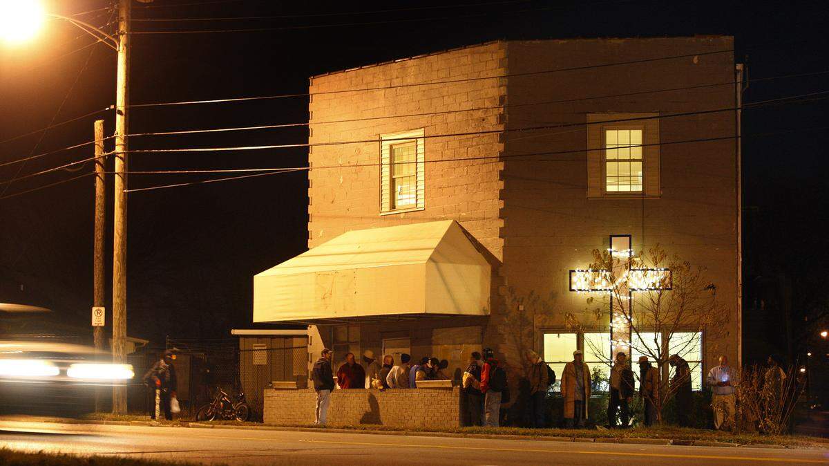People lined up Thursday as they waited to enter downtown Lexington's Community Inn, where the doors open every night at 7. The shelter regularly serves as many as 75 men and 30 women.