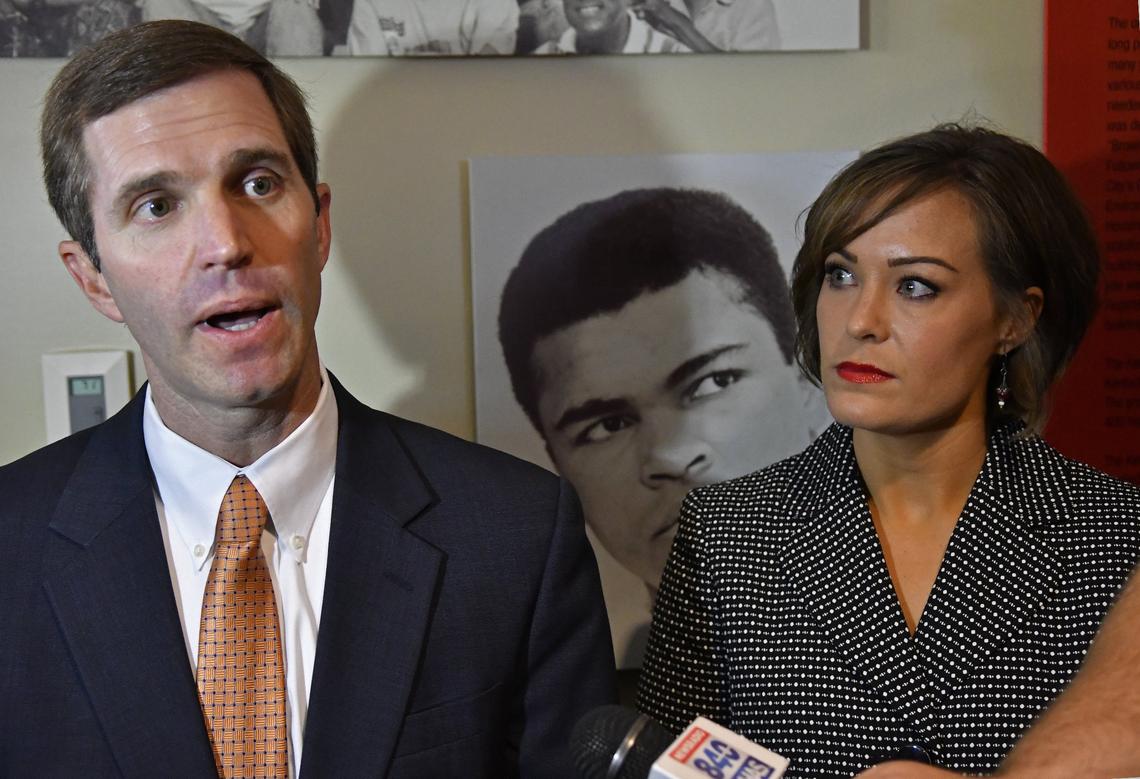 Kentucky Attorney General and democratic gubernatorial candidate Andy Beshear, left, answers a reporter's question as his running mate, lieutenant gubernatorial candidate Jacqueline Coleman, looks on following their announcement at the Kentucky Center for African American Heritage in Louisville, Ky, Monday, July 9,  2018.