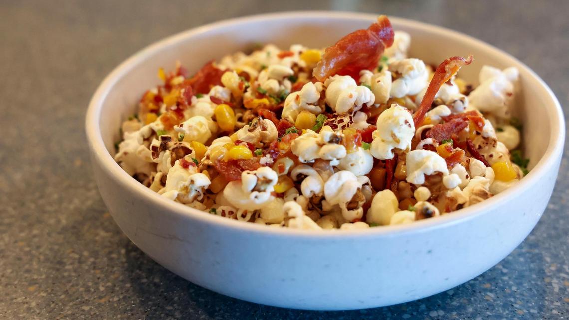 The Popcorn Homage appetizer ($12) at Azur Restaurant and Patio, shown Monday, May 20, 2025 in Lexington, Ky. Homemade pan-popped popcorn with chorizo butter, crispy Benton’s country ham, Nana’s fried corn and garden fresh chives.
