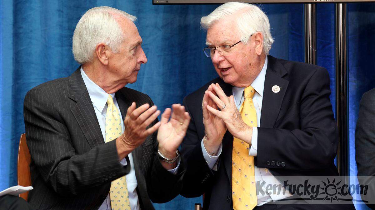 Ky. Gov. Steve Beshear, left, talked to U.S. Rep. Hal Rogers, right, as they applauded during a morning news conference held at the University of Kentucky Chandler Hospital in Lexington, Ky., Friday, July 12, 2013. UK  announced it's Markey Cancer Center has received a Cancer Center designation from National Cancer Institute which brings it additional federal research money. Only 67 other hospitals have received this designation, with UK being the first in Kentucky. Photo by Charles Bertram | Staff