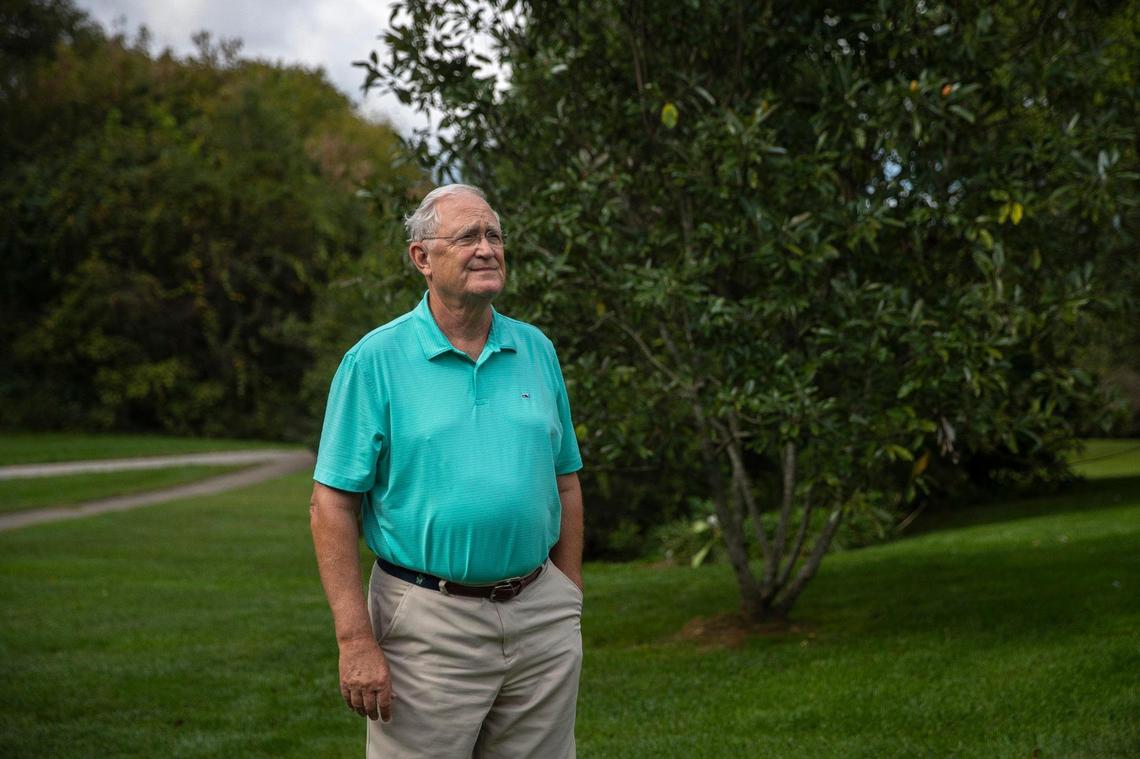 David O’Bryan poses for a portrait in his backyard in the Lansdowne area of Lexington, Ky., on Tuesday, Oct. 12, 2021. Trees near power lines are slated to be cut down.