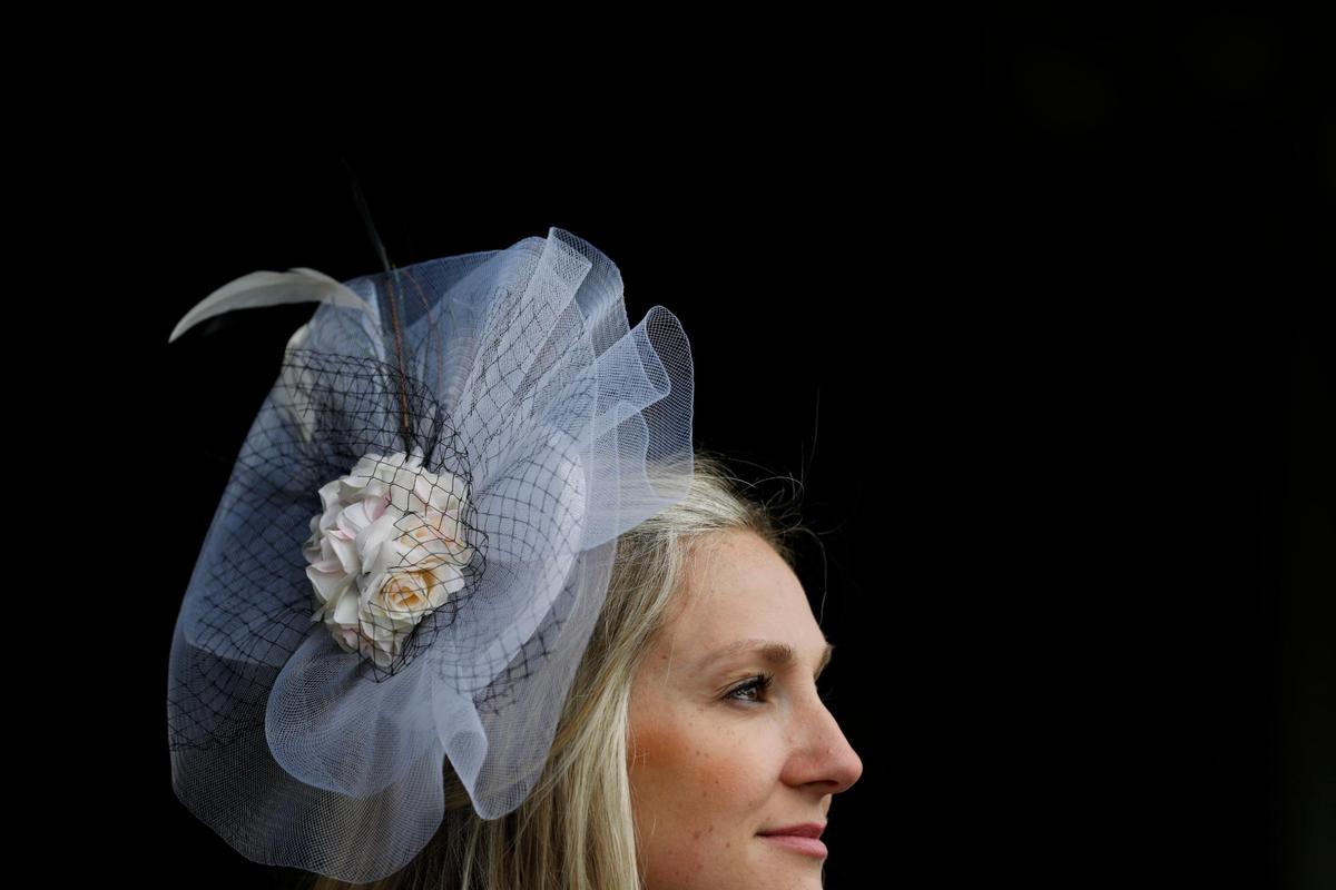 Megan Schruber wears a fascinator she purchased from Amazon at Churchill Downs in Louisville, Ky., Saturday, May 7, 2022.