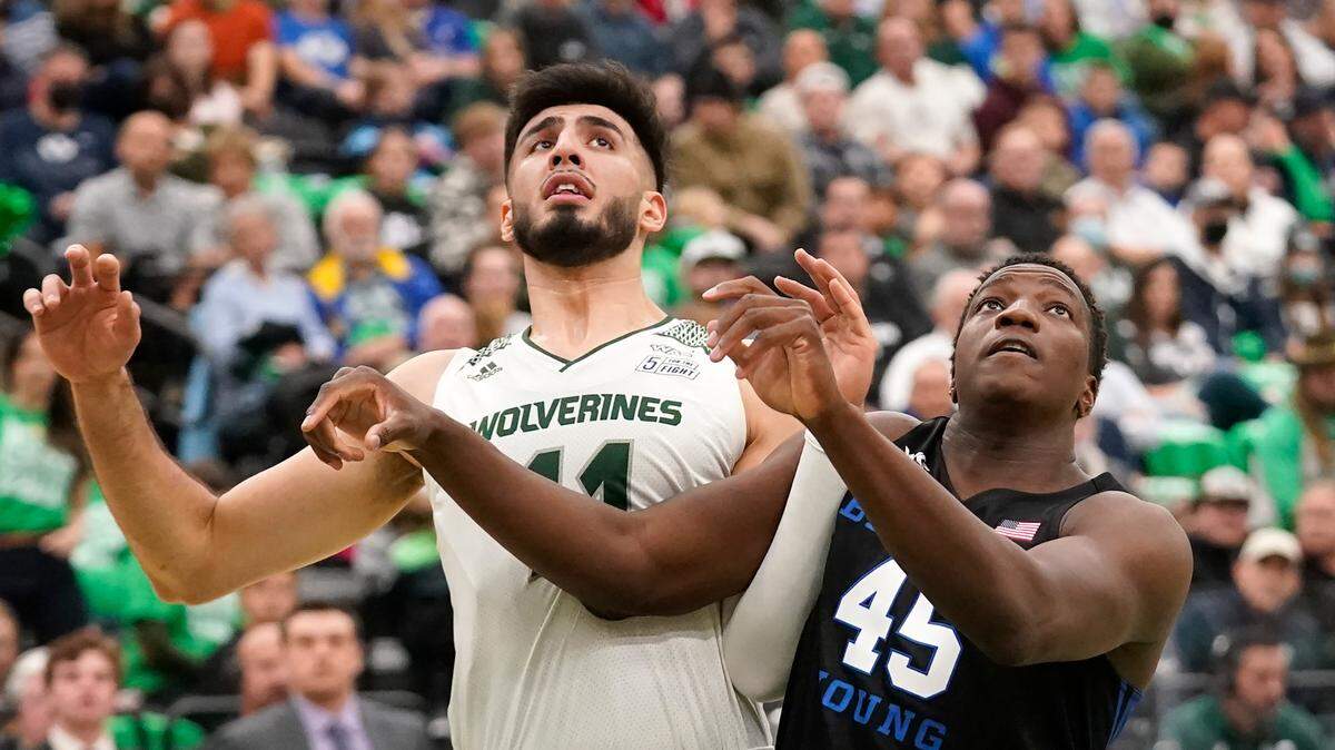 Utah Valley center Fardaws Aimaq, left, led the nation in rebounding during the 2020-21 season.