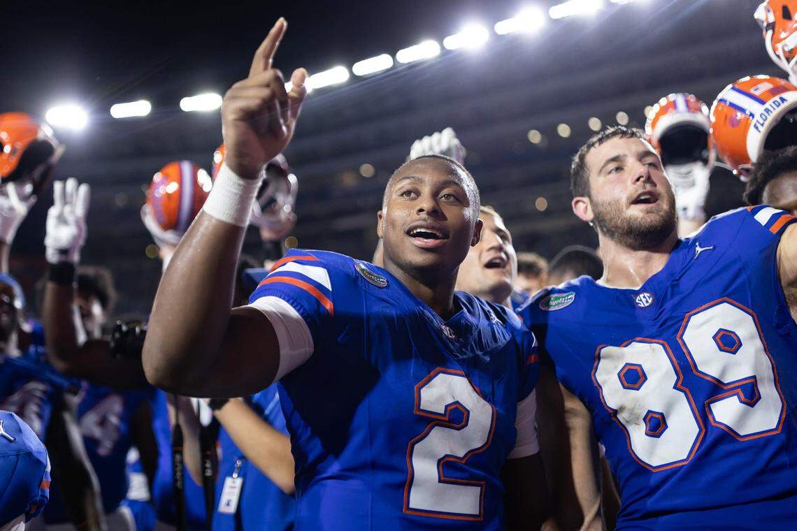 Oct 5, 2024; Gainesville, Florida, USA; Florida Gators quarterback DJ Lagway (2) signs the alma mater with Florida Gators tight end Hayden Hansen (89) after a game against the UCF Knights at Ben Hill Griffin Stadium. Mandatory Credit: Matt Pendleton-Imagn Images