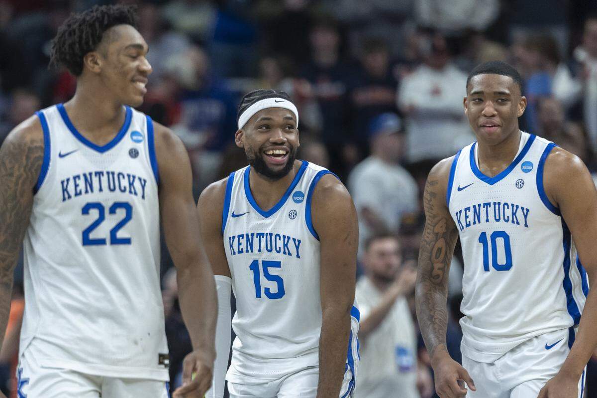 Kentucky’s Amari Williams (22), Ansley Almonor (15) and forward Brandon Garrison (10) react following a second-round NCAA Tournament victory against Illinois at Fiserv Forum in Milwaukee on Sunday.