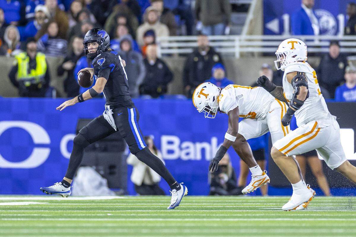Kentucky quarterback Cutter Boley (8) runs from pressure during Saturday’s game against Tennessee at Kroger Field.