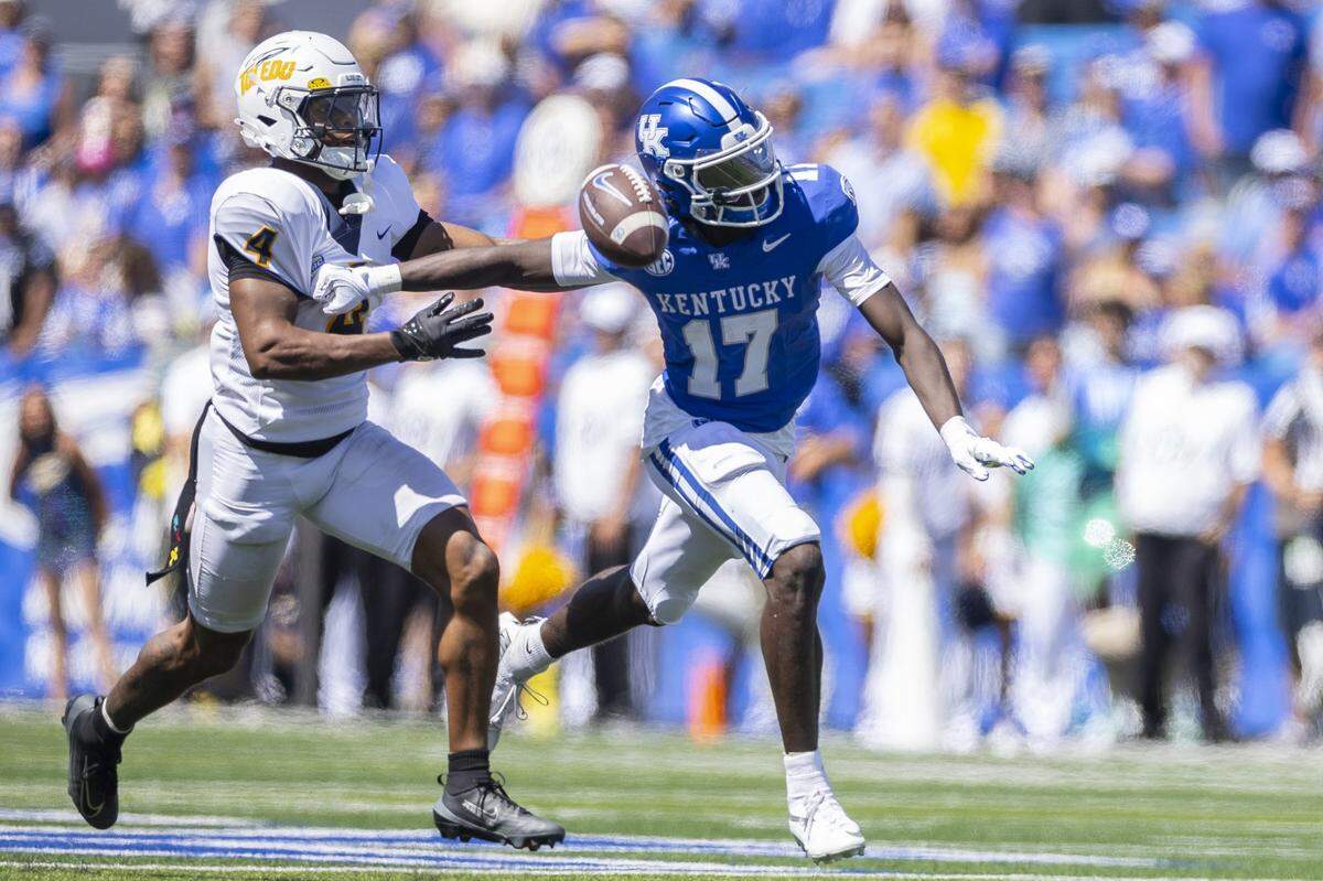 Toledo cornerback Avery Smith (4) breaks up a pass intended for Kentucky wide receiver Hardley Gilmore (17) during Saturday’s game at Kroger Field.