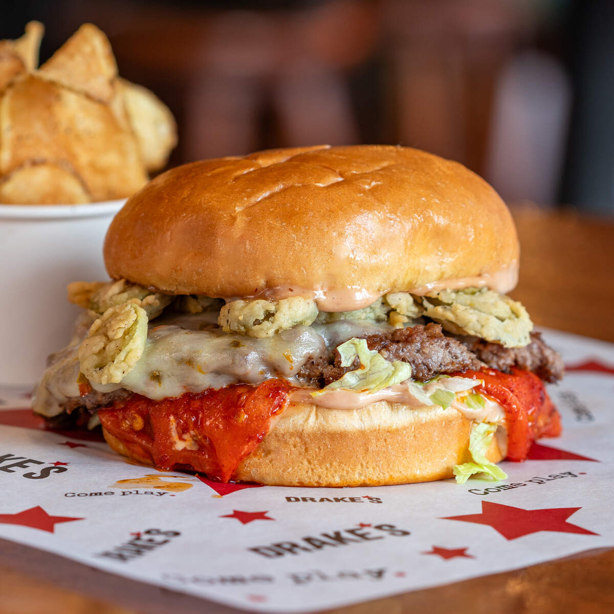 Drake’s Fireworks Burger for Lexington Burger Week 2026 includes ghost pepper cheese, fried pickled jalapeños, shredded lettuce, tomato and habanero mayo.