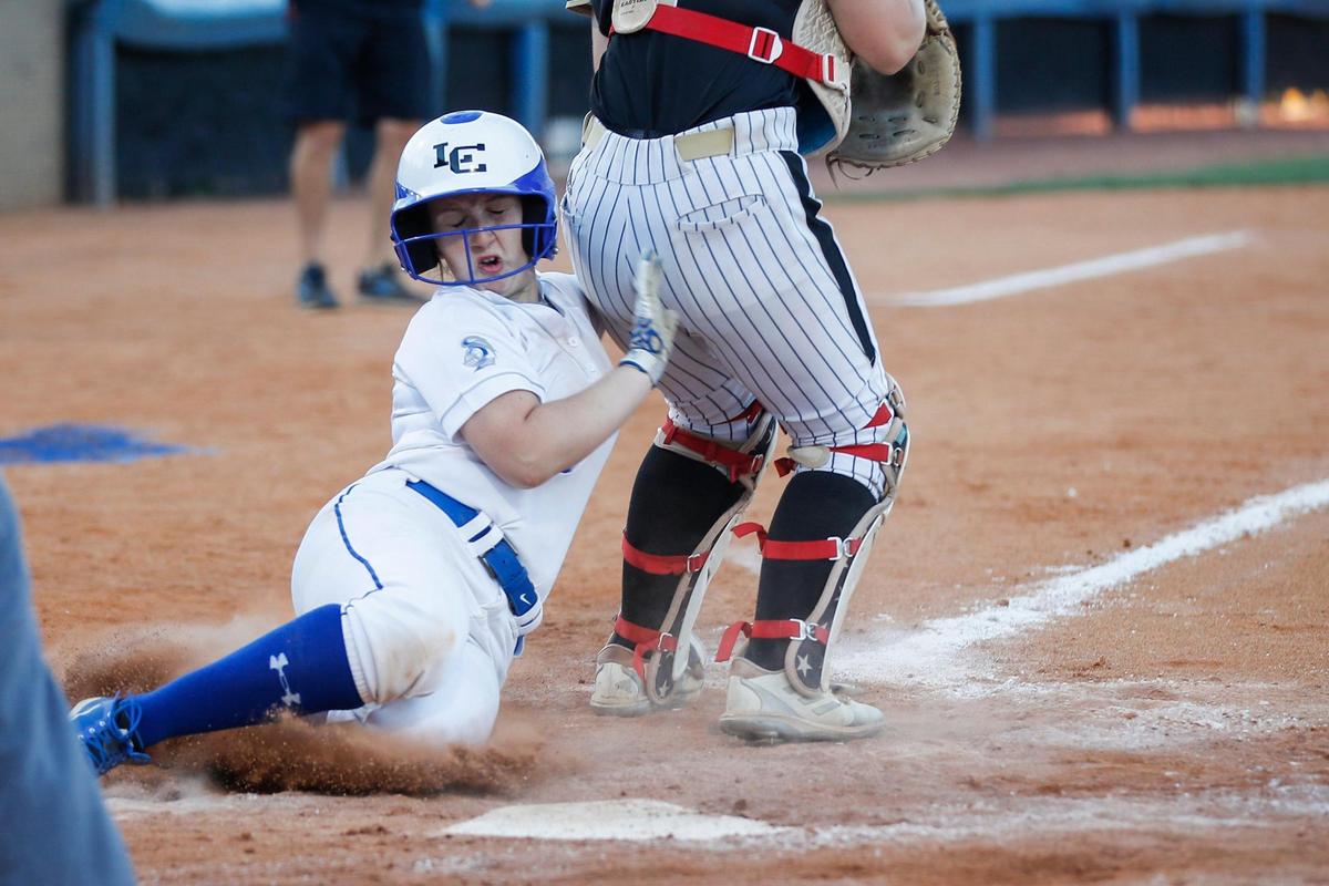Lexington Catholic’s Kinley Willoughby (33) scores the winning run in the seventh inning against Boyle County.
