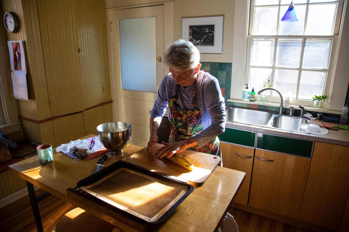 The chilled biscotti dough is arranged into a long loaf before baking the first time.