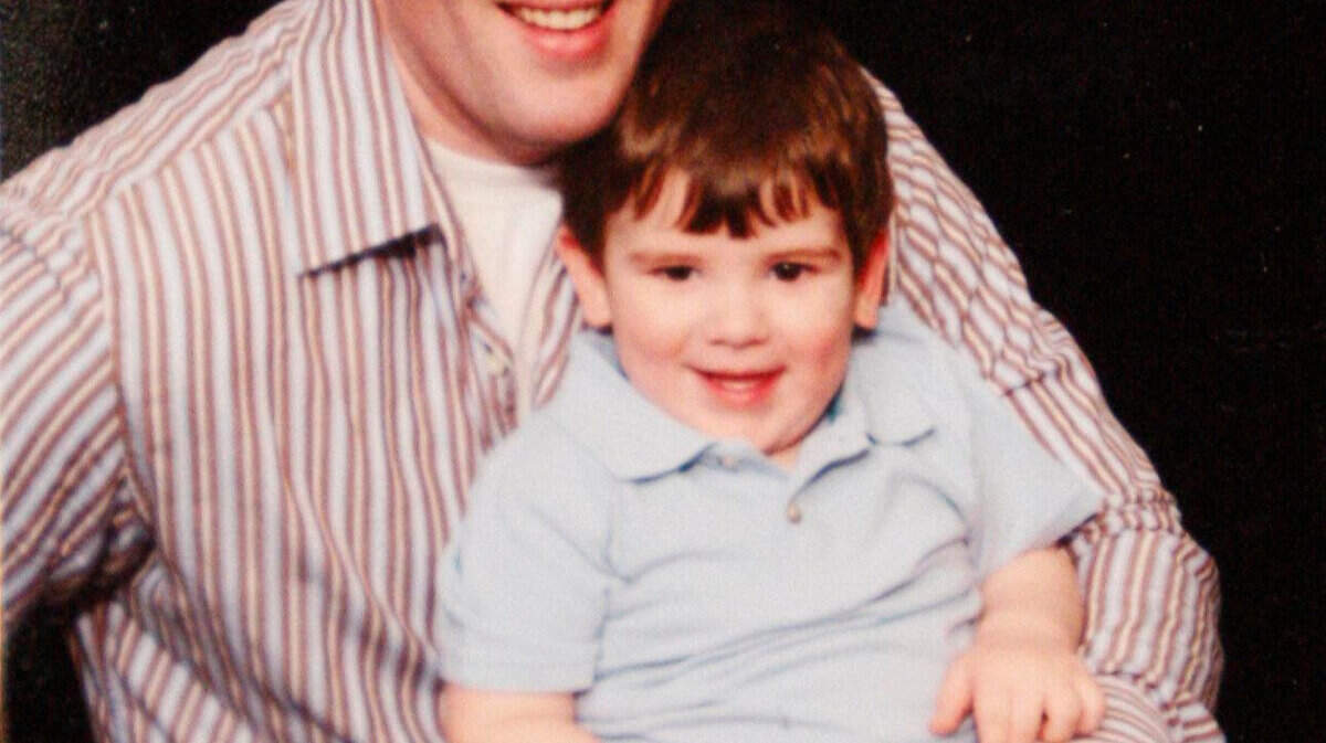 A photo shows Lexington police officer Bryan Durman, who was struck & killed Thursday night, with his son Brayden, now 4, at police headquarters in Lexington, Ky., Sunday, May 2, 2010. Photo by Matt Goins 10013