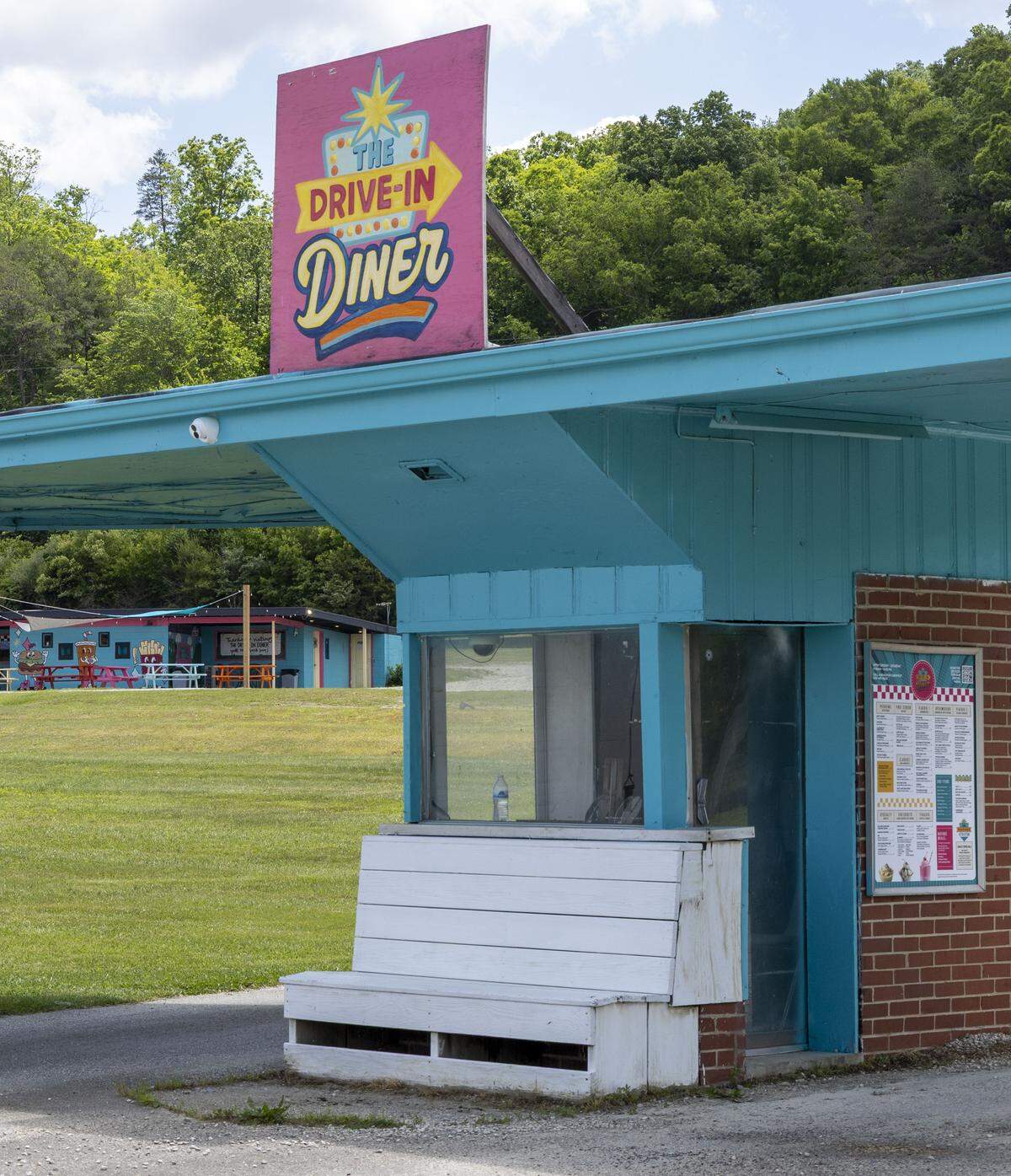 The ticket booth for the Mountain View Drive-In in Stanton, Ky. has been repainted and is a sign for the Drive-In Diner, a restaurant located in the concession stand, seen here in the background. 