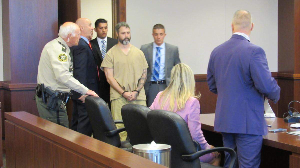Police officers led Casey Byrd into Laurel District Court for a hearing on Nov. 8, 2022 He is charged with hitting and killing a London, Ky., police office while driving drunk.
