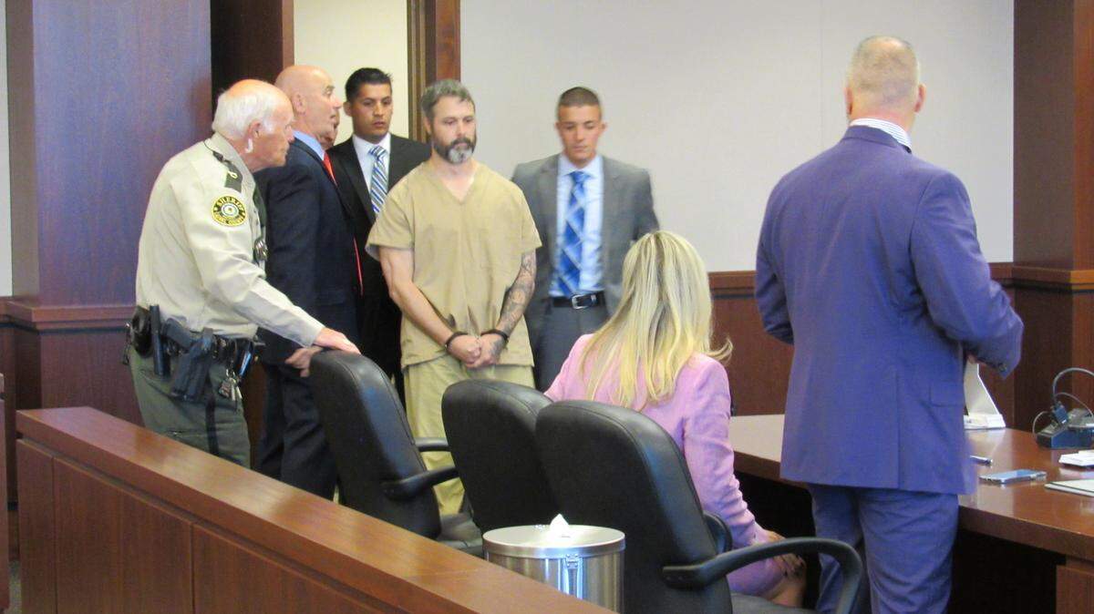 Police officers led Casey Byrd into Laurel District Court for a hearing on Nov. 8, 2022 He is charged with hitting and killing a London, Ky., police office while driving drunk.