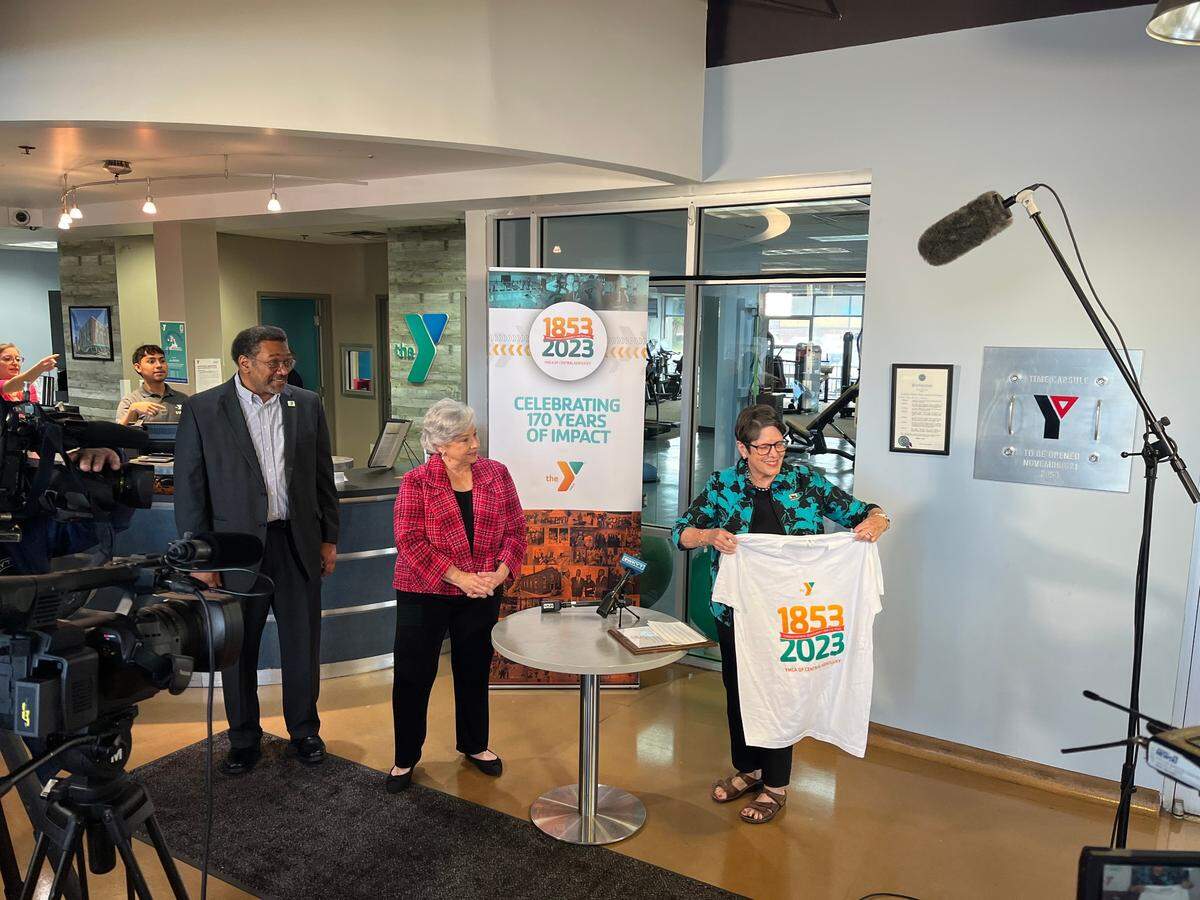 Mayor Linda Gorton shows off the t-shirt received from the YMCA of Central Kentucky before declaring November as YMCA Month in honor of the group celebrating its 170th birthday.