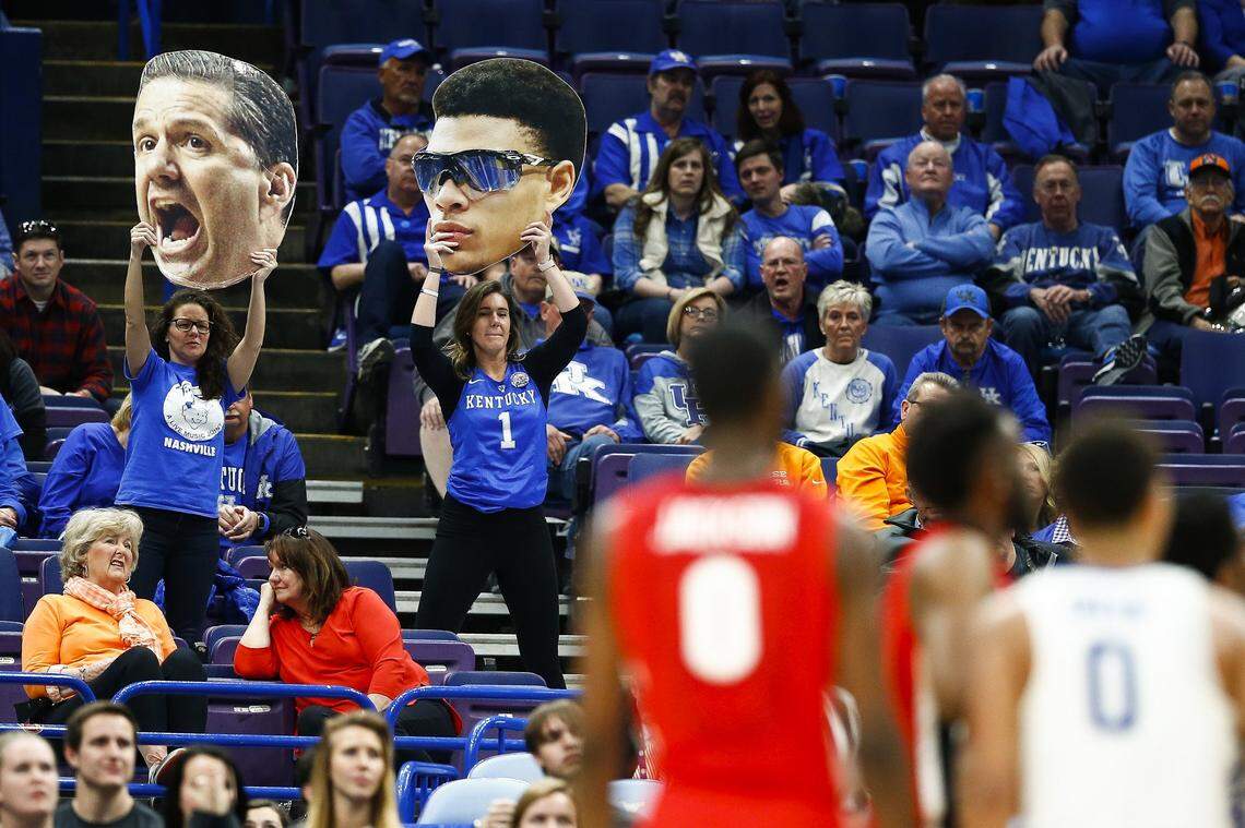 Kentucky fans cheered with cutouts of Kentucky coach John Calipari and guard Quade Green during UK’s 62-49 win against Georgia in the 2018 SEC Tournament quarterfinals in St. Louis. The 2018 SEC tourney remains the most recent won by UK.