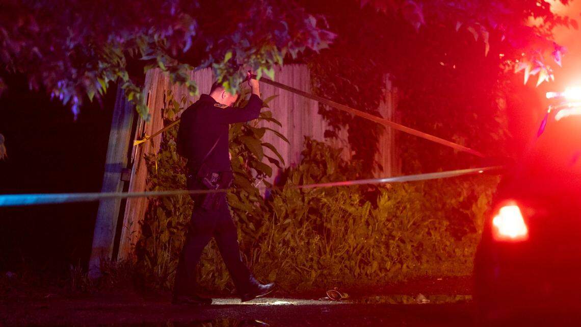 Police officers investigate the area of a reported shooting on Idaho Avenue near Dakota Street in Lexington, Ky, Friday, May 17, 2024.