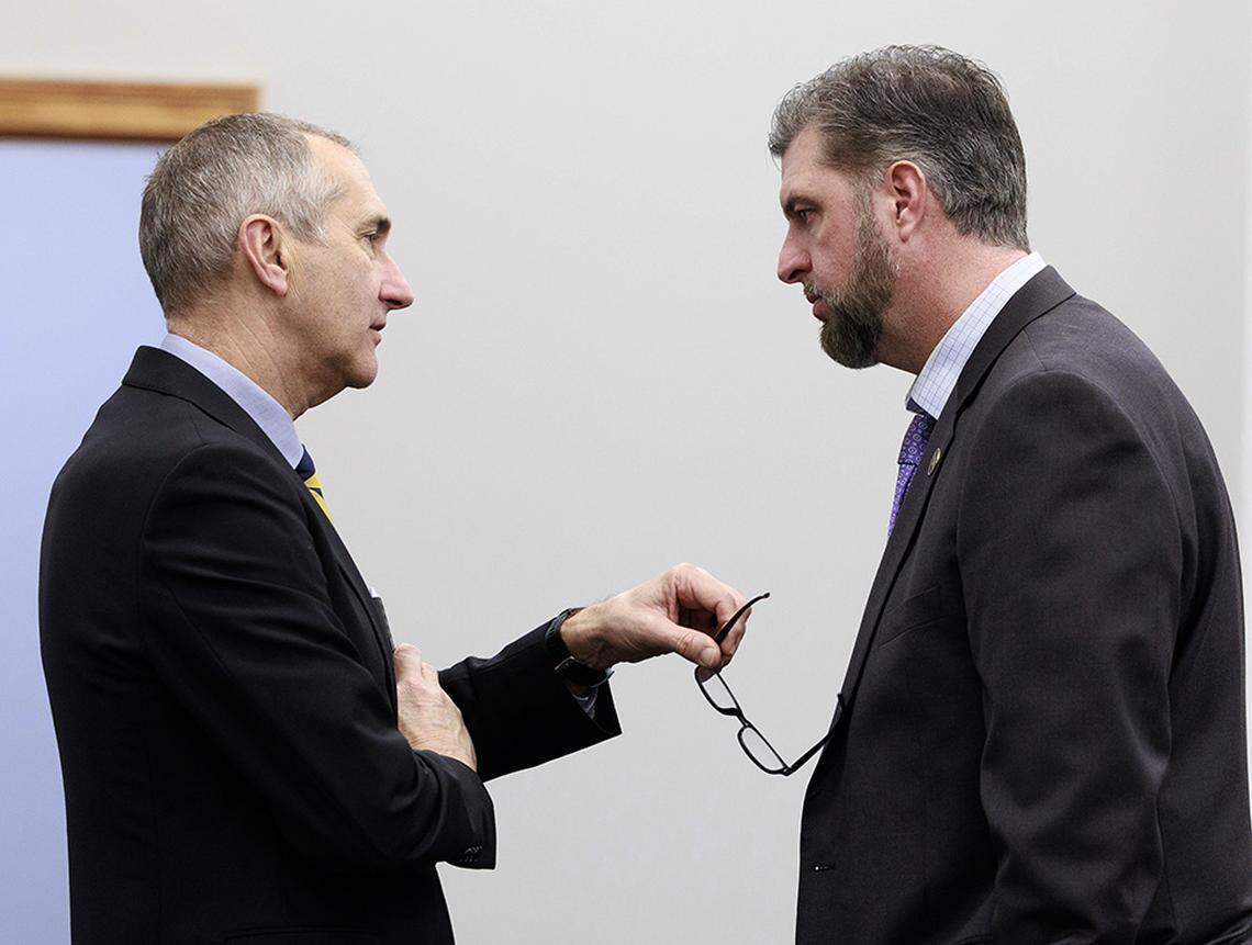 Senate President Pro Tempore David P. Givens, R-Greensburg, speaks with Sen. Jared Carpenter, R-Berea, on the Senate floor in January.