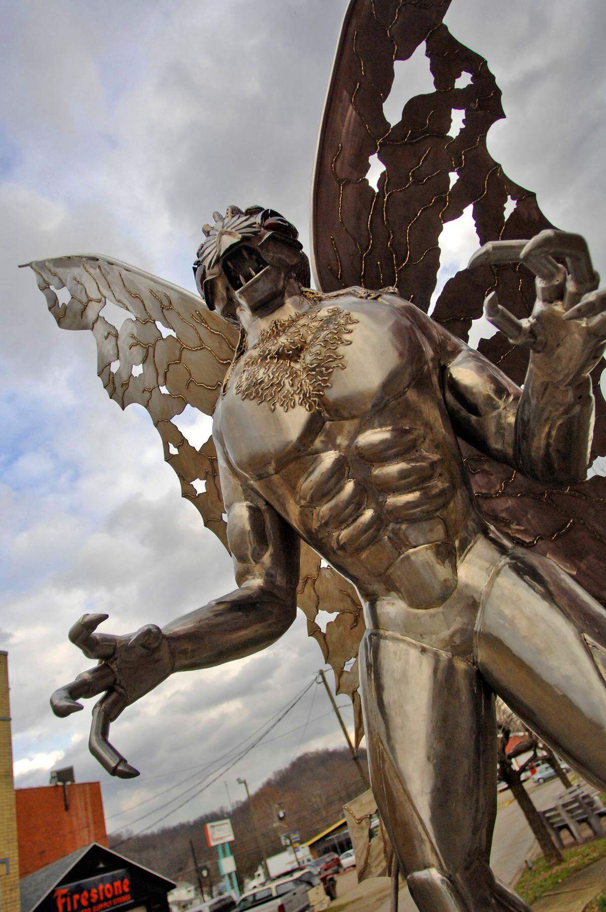 A large Mothman sculpture stands along Main Street Tuesday, Dec. 11, 2007 in Point Pleasant, W.Va. More than 40 years after the first reported sighting of the mysterious creature later dubbed “Mothman,” residents here have embraced his legend, helping to turn the town into a destination for people in search of an offbeat tourism experience. (AP Photo/Jeff Gentner)