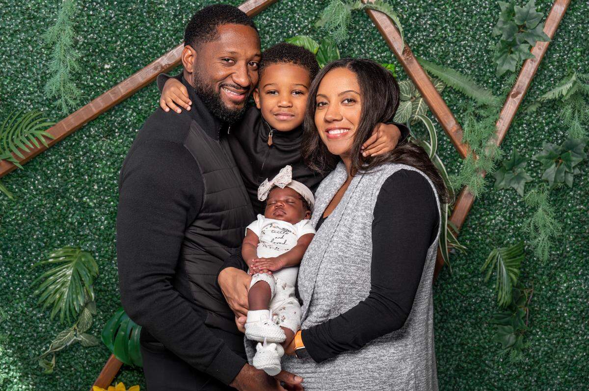 Keenan Burton’s family includes son Kacen, center, wife Tracy, right, and baby daughter Brielle.