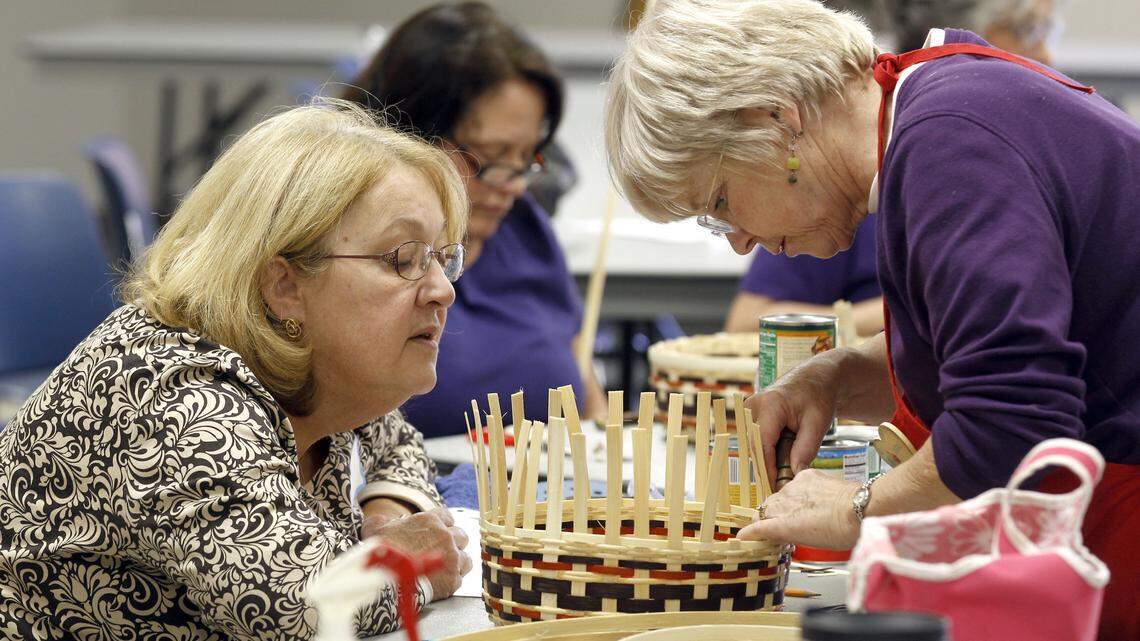 Patty Casey, left, got some help from instructor Mary McAllister during a basket-weaving 
workshop last week at the Fayette County Extension Service. The workshop is offered monthly.
