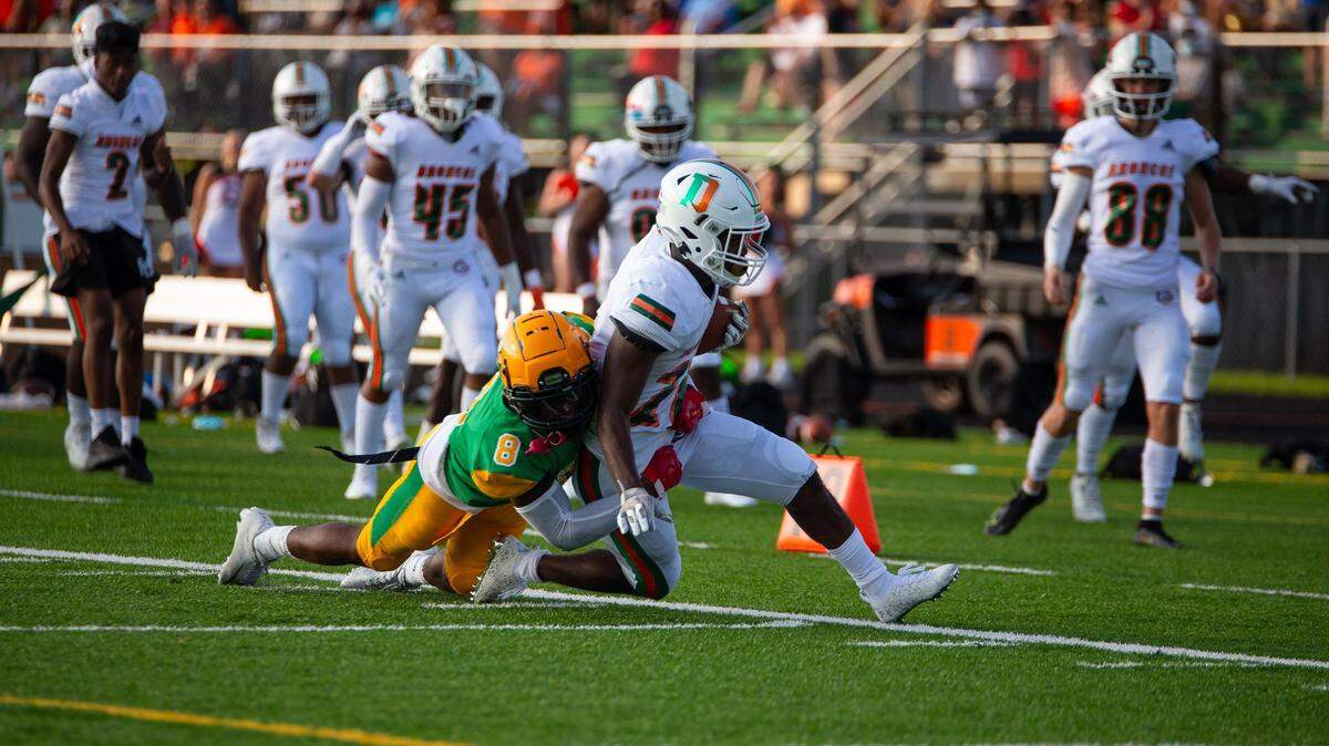 Bryan Station defensive back Antonio Davis tackles Frederick Douglass running back Davaun Hart (26) during the game on Friday, Aug. 20, 2021, at Bryan Station High School in Lexington, Kentucky.